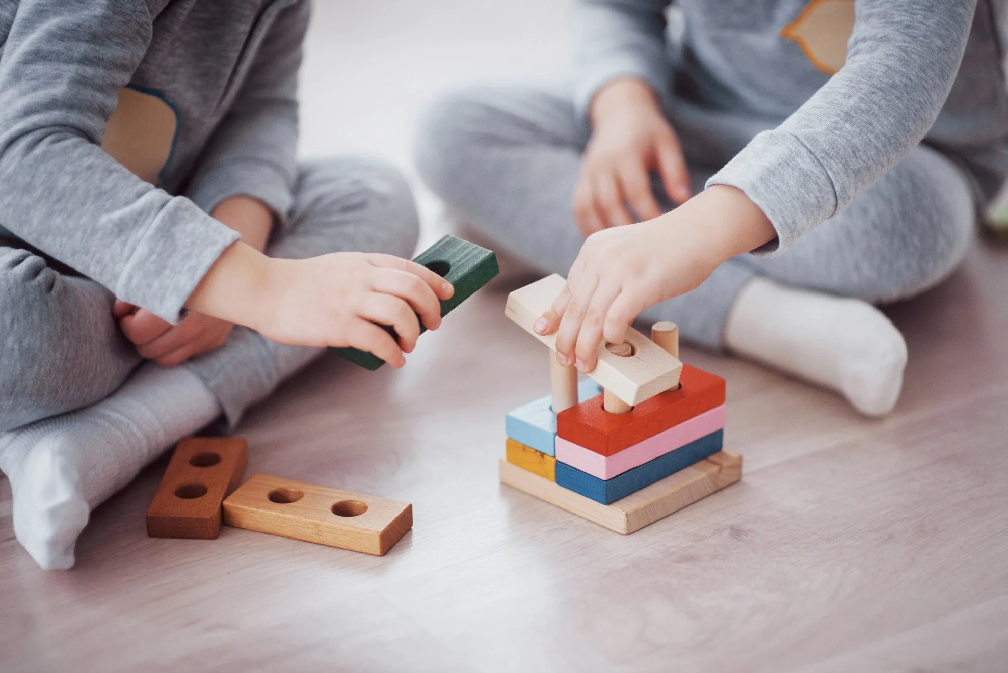 Children Stacking Building Blocks