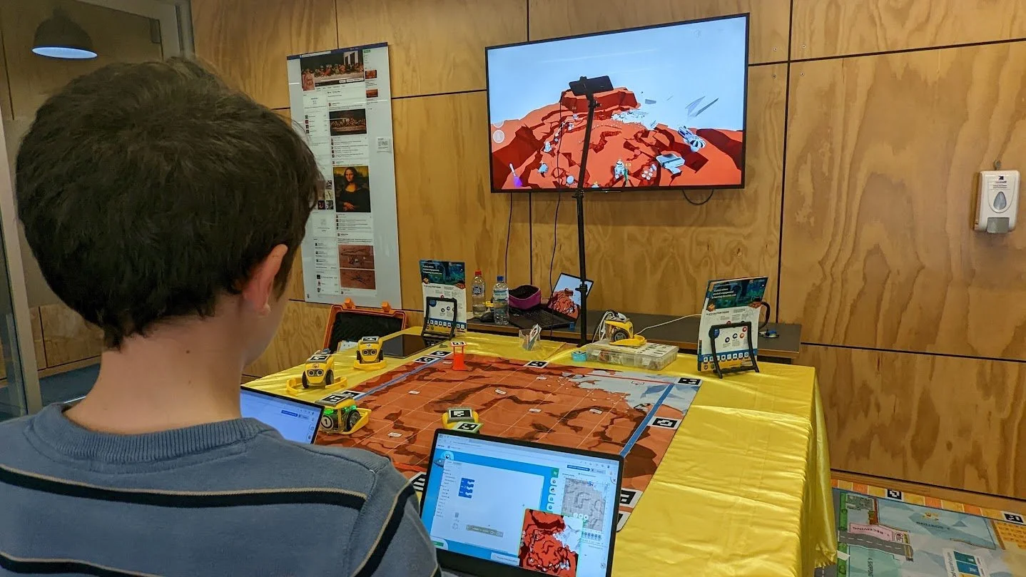 Students Coding Kai's Clan on a Laptop