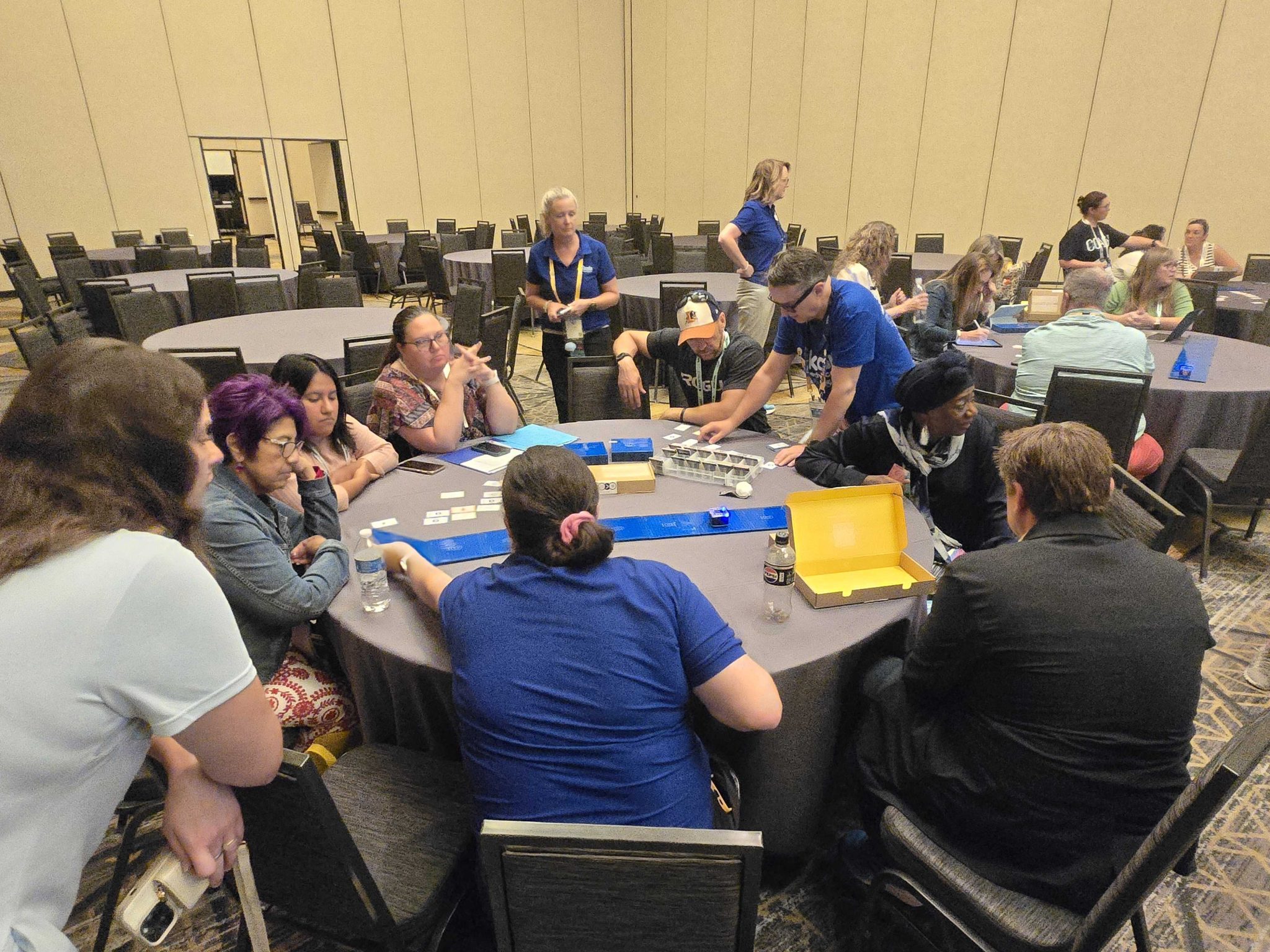 Teachers Using KaiBot Around a Table