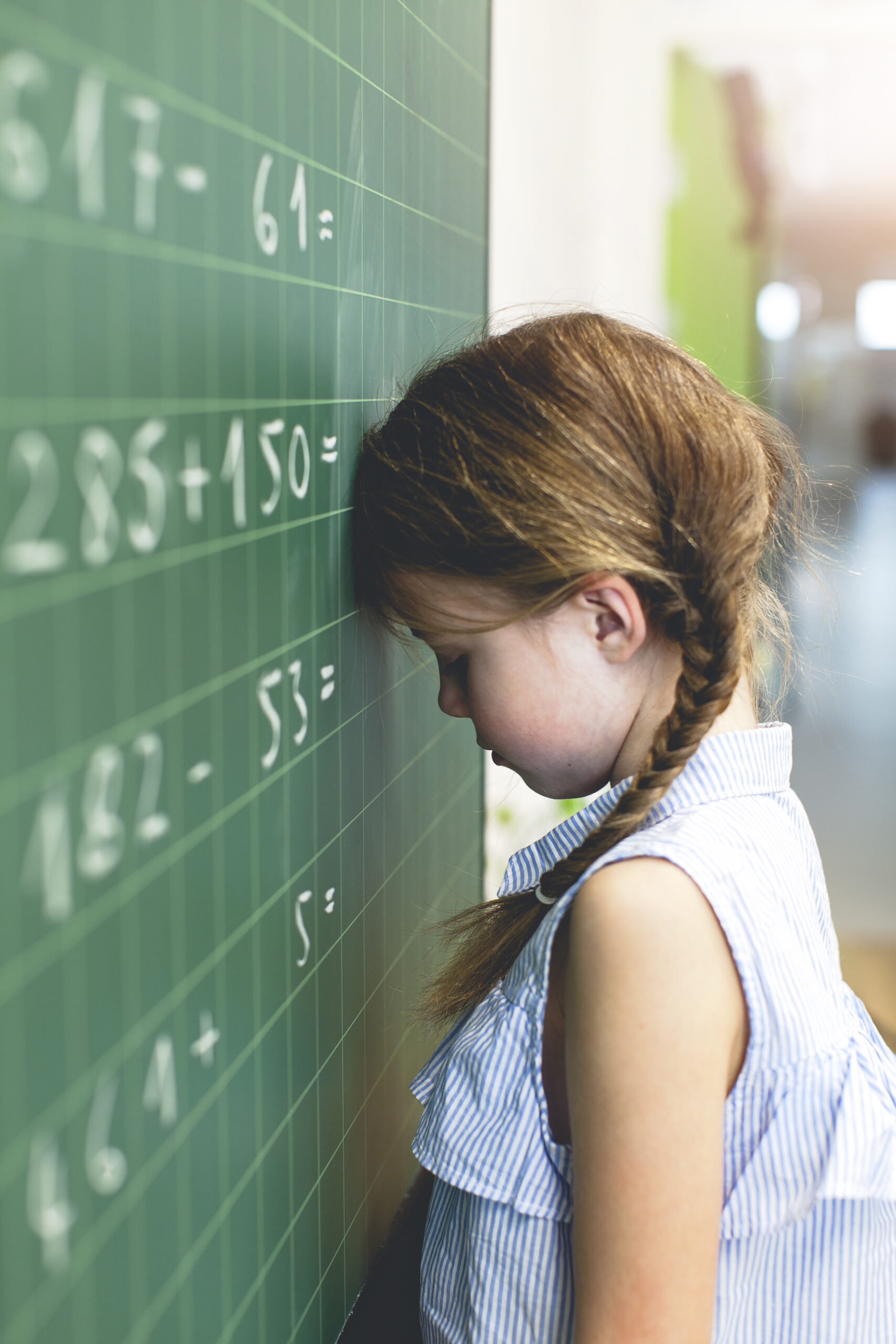 Sad Student Counting on Blackboard